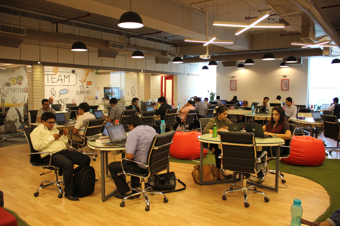 Collaborative co-working lounge with shared seating and breakout areas